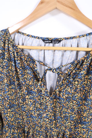 שמלת אוברסייז פרחונית בכחול וכתום- M-L שמלת אוברסייז פרחונית בכחול וכתום- M-L