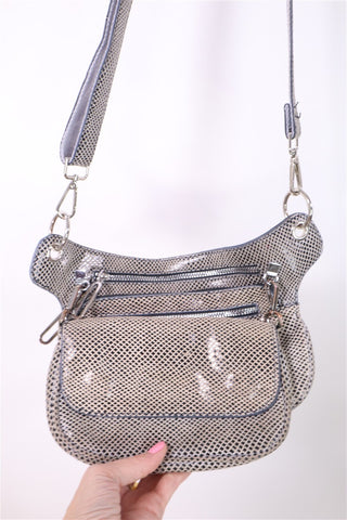 תיק עור מעוצב ומנצנץ במוקה-OS