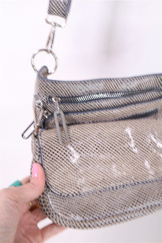 תיק עור מעוצב ומנצנץ במוקה-OS